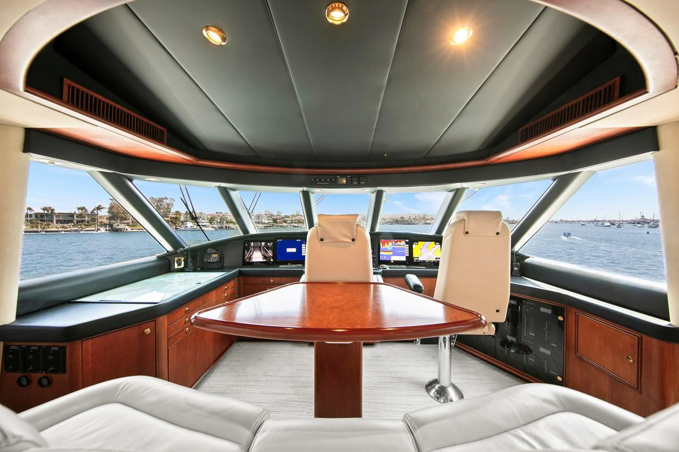 The helm of the yacht features a spacious and well-appointed command center with panoramic views. aboard GOLDEN BOY II Yacht for Sale