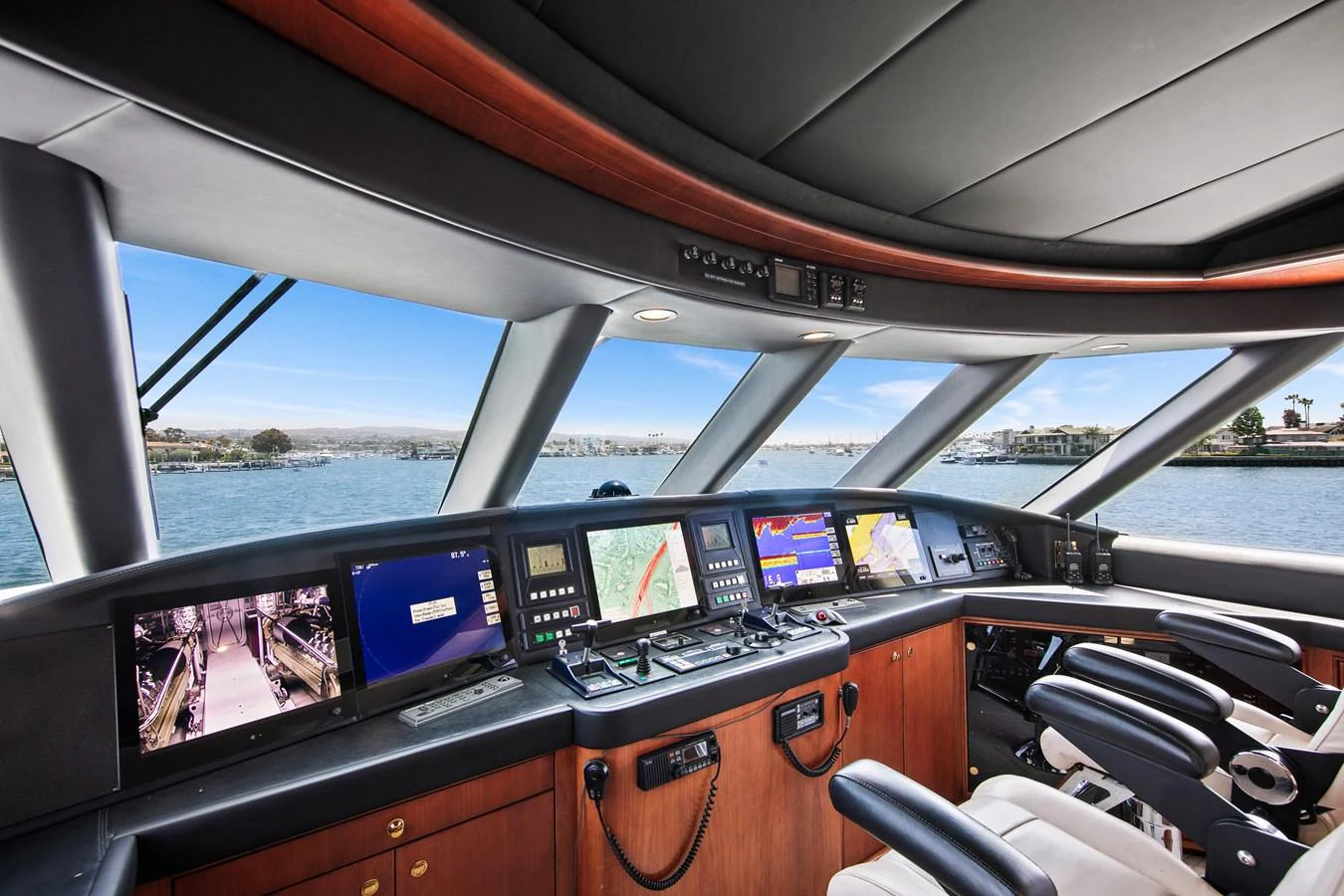 The helm features advanced navigation systems and a panoramic view of the water. aboard GOLDEN BOY II Yacht for Sale