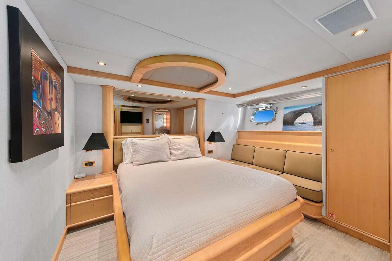 The master stateroom features a spacious bed, elegant decor, and ample natural light. aboard GOLDEN BOY II Yacht for Sale