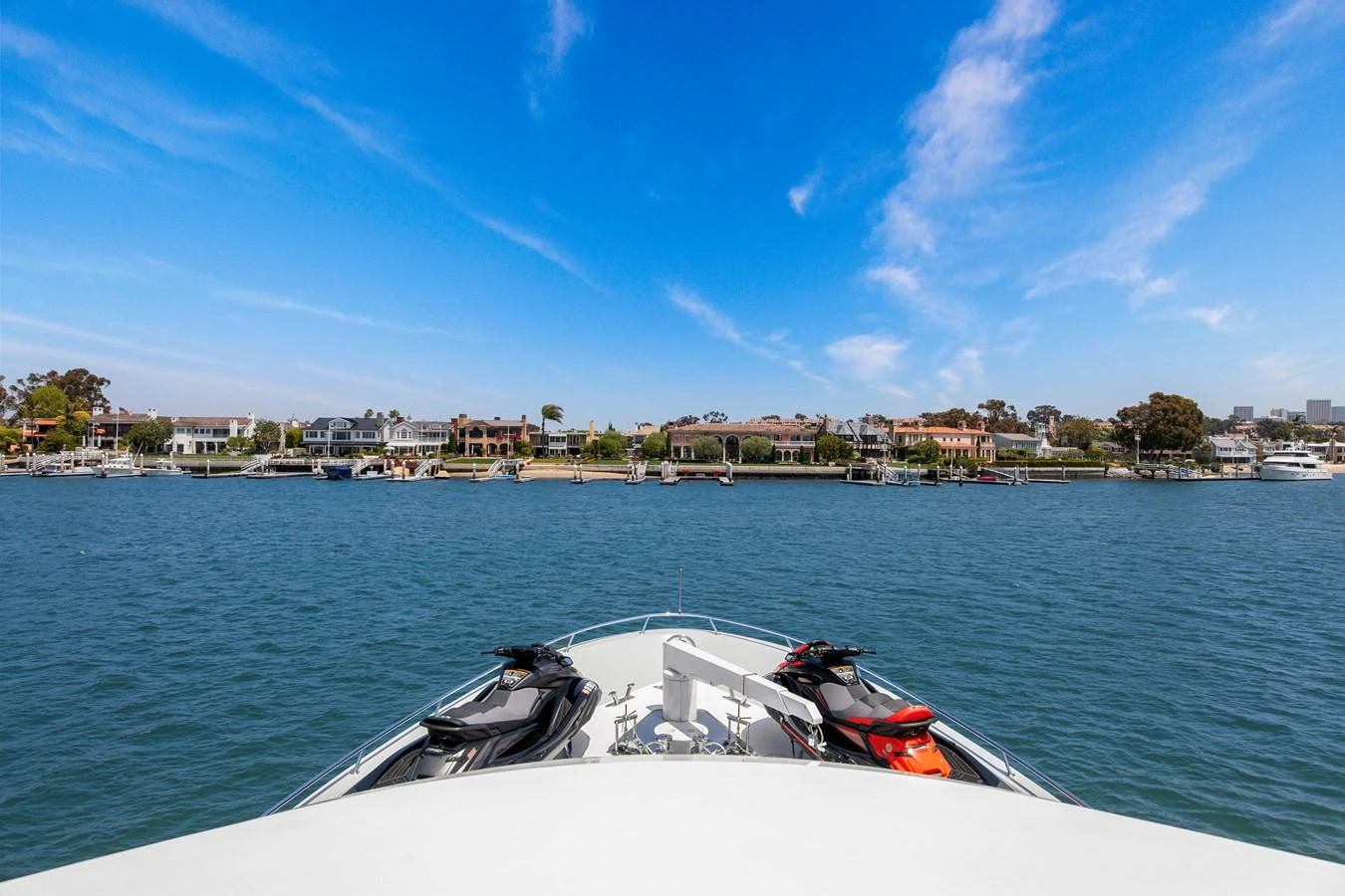 A view from the bow of the yacht, showcasing the serene waters and a picturesque shoreline in the background. aboard GOLDEN BOY II Yacht for Sale