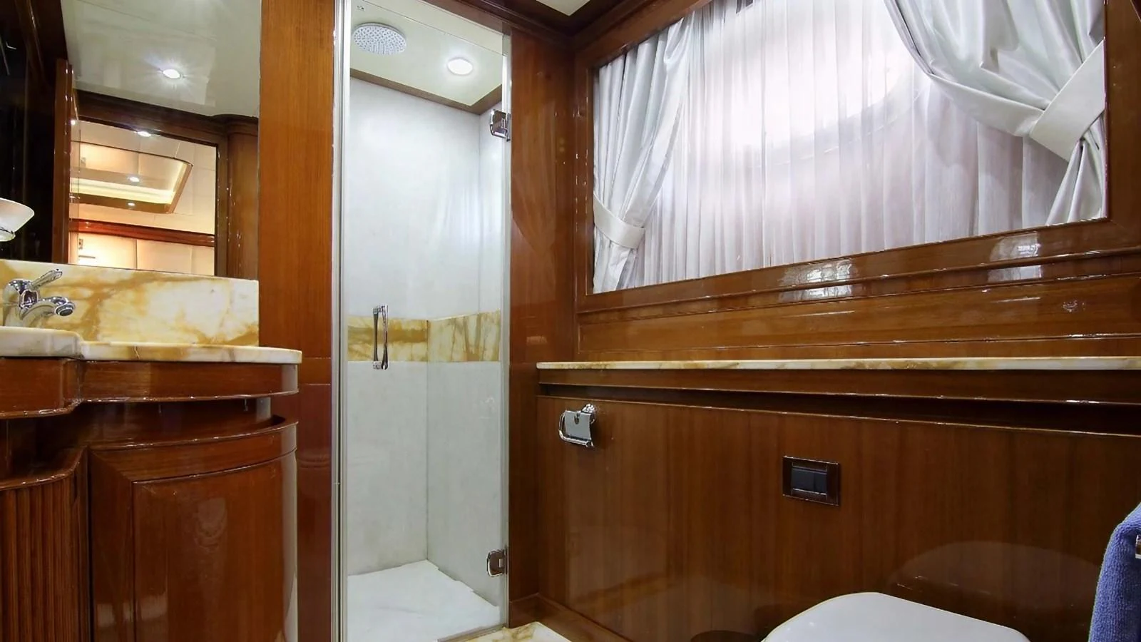 a bathroom with a shower and sink aboard ELVI Yacht for Sale