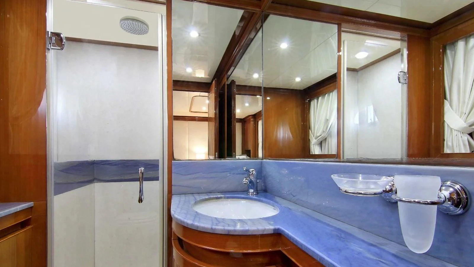 a bathroom with a large mirror aboard ELVI Yacht for Sale