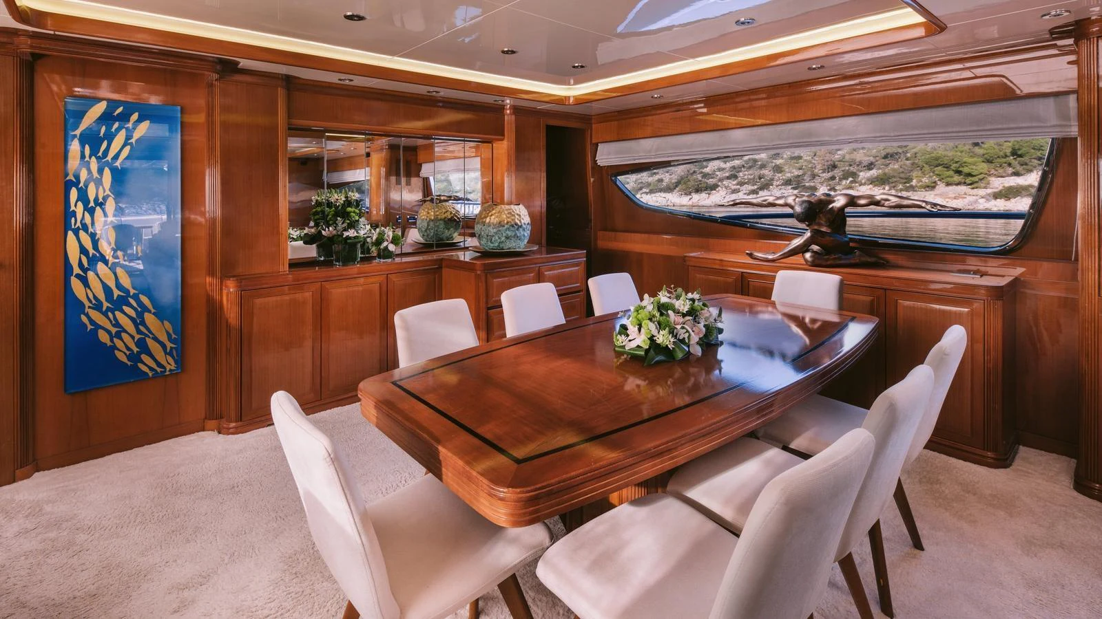 a dining table in a restaurant aboard ELVI Yacht for Sale