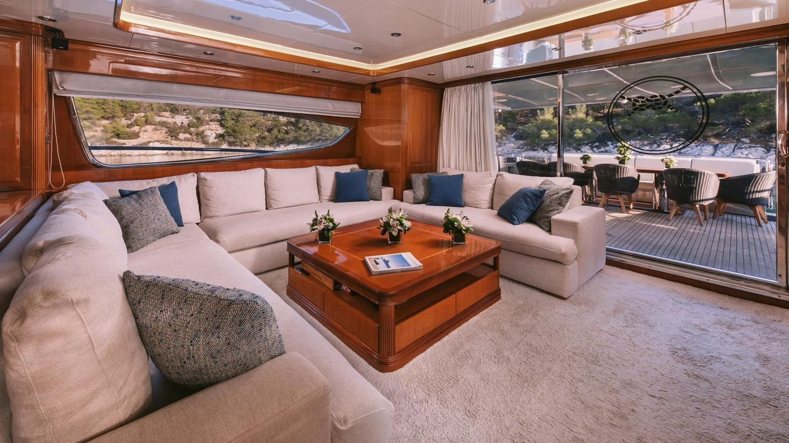 a living room with a couch and a table aboard ELVI Yacht for Sale