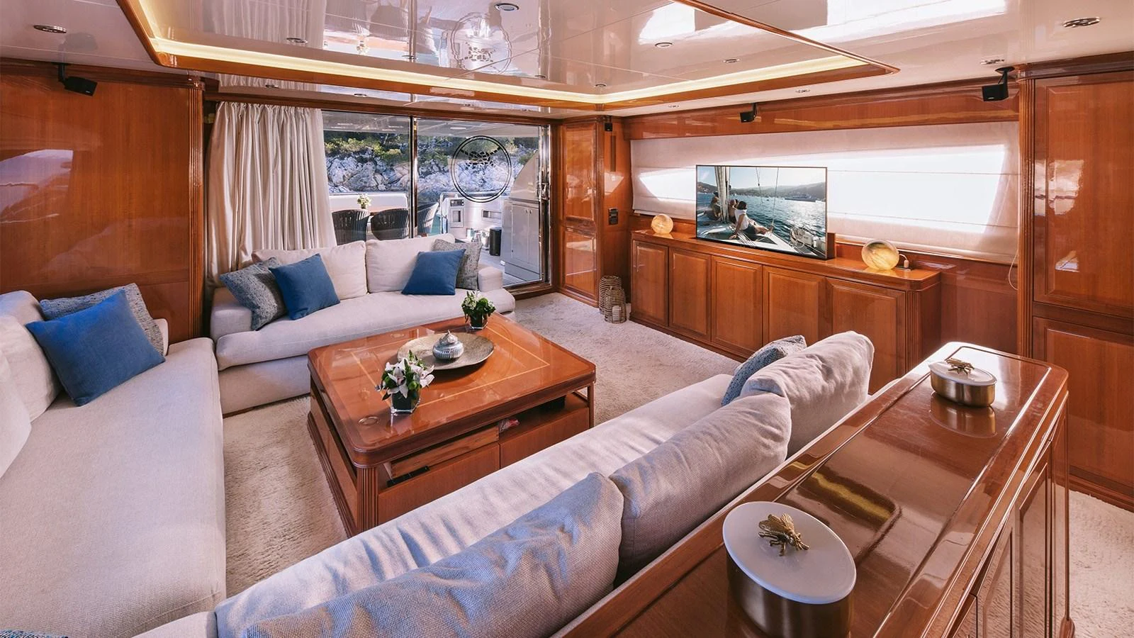 a living room with a couch and a table aboard ELVI Yacht for Sale
