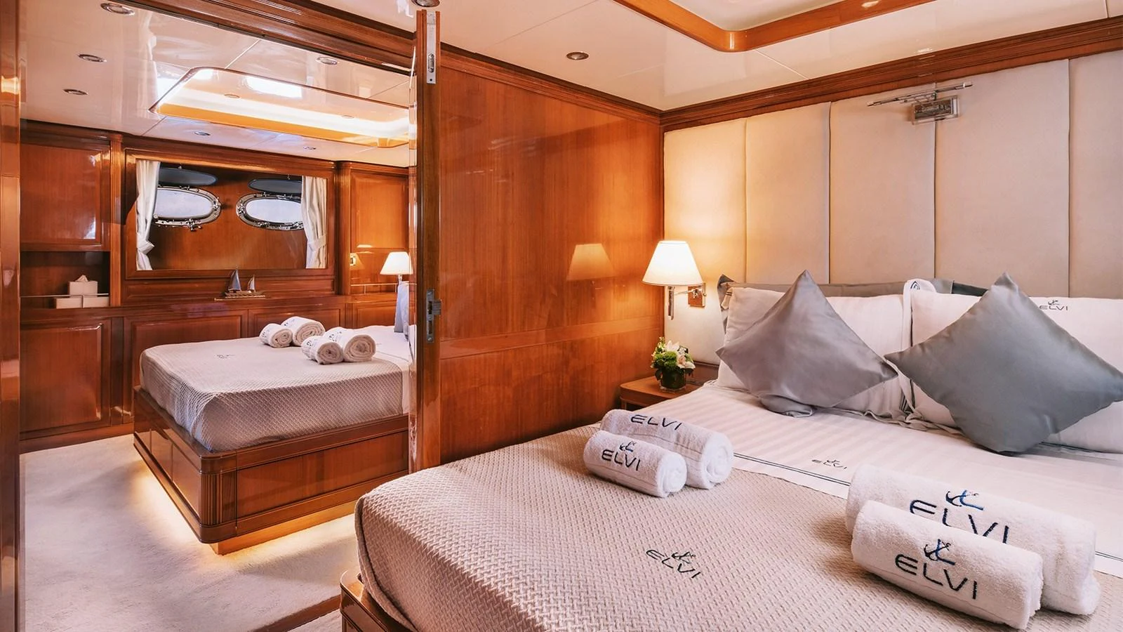 a room with a bed and a mirror aboard ELVI Yacht for Sale