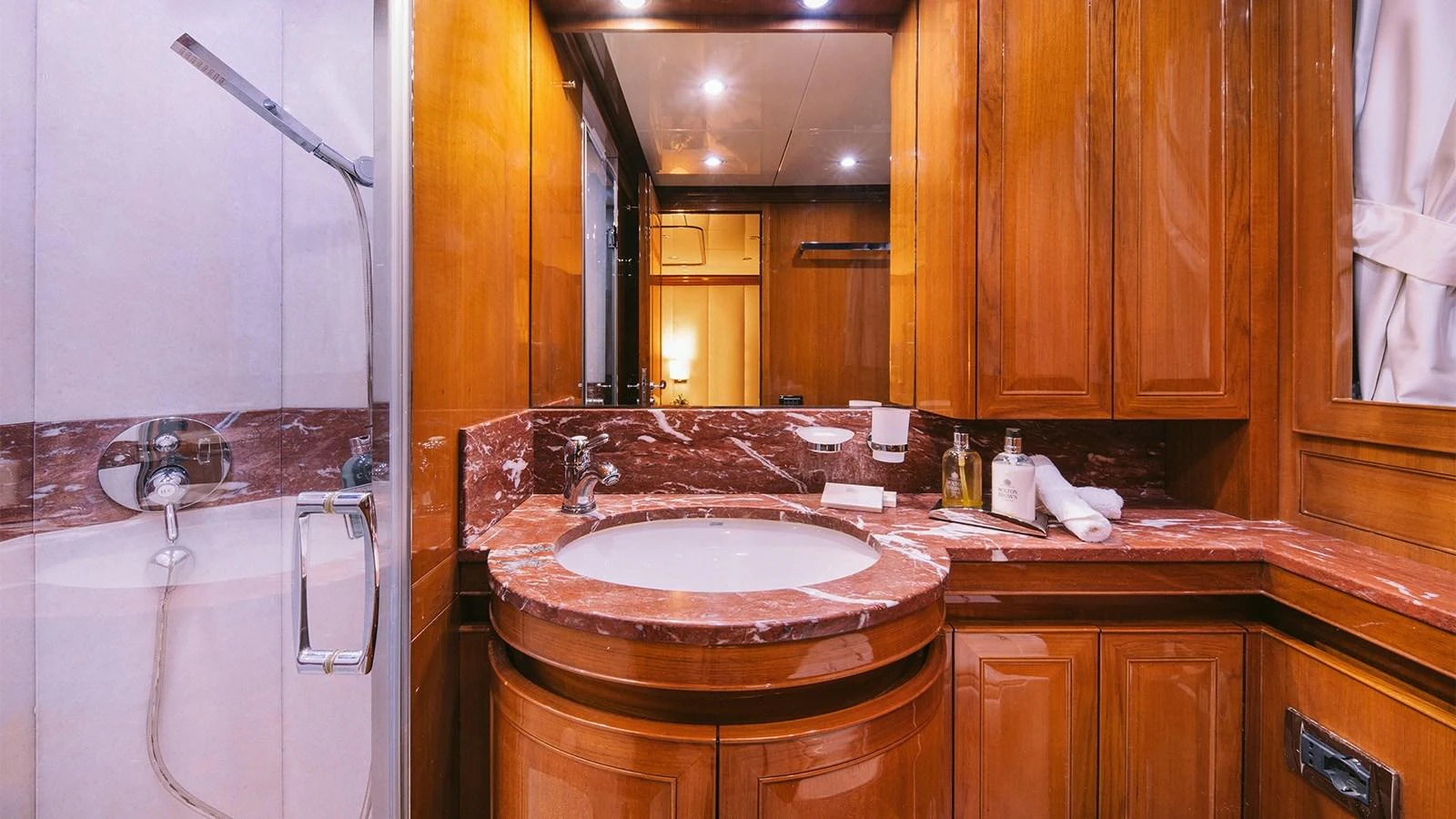 a bathroom with a sink and a mirror aboard ELVI Yacht for Sale