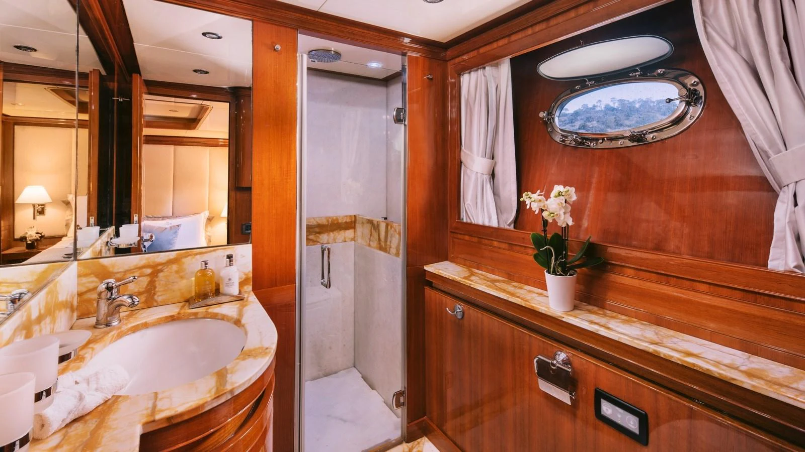 a bathroom with a large mirror aboard ELVI Yacht for Sale
