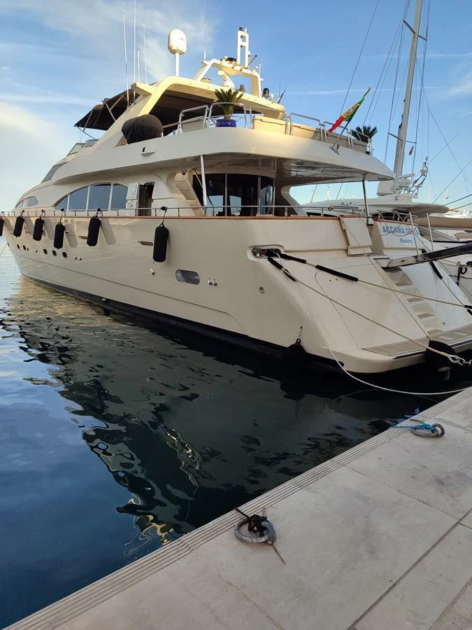 This elegant yacht is docked at a marina, showcasing its sleek design and luxurious amenities. aboard ACCAMA DELTA Yacht for Sale