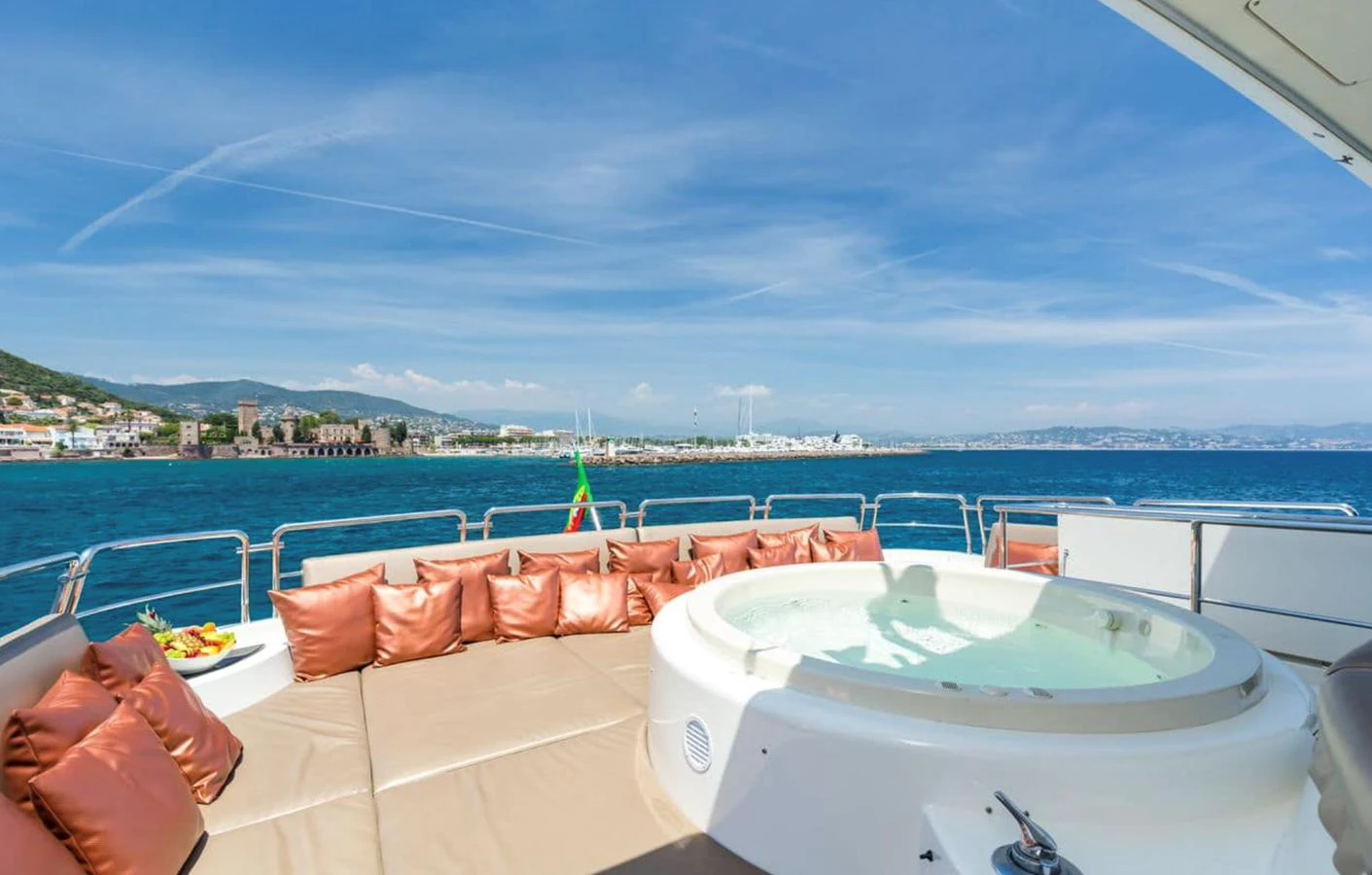 The sundeck features a luxurious jacuzzi surrounded by plush seating, offering stunning ocean views. aboard ACCAMA DELTA Yacht for Sale
