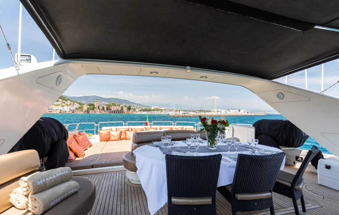 The aft deck features an elegant dining area with a stunning view of the sea. aboard ACCAMA DELTA Yacht for Sale