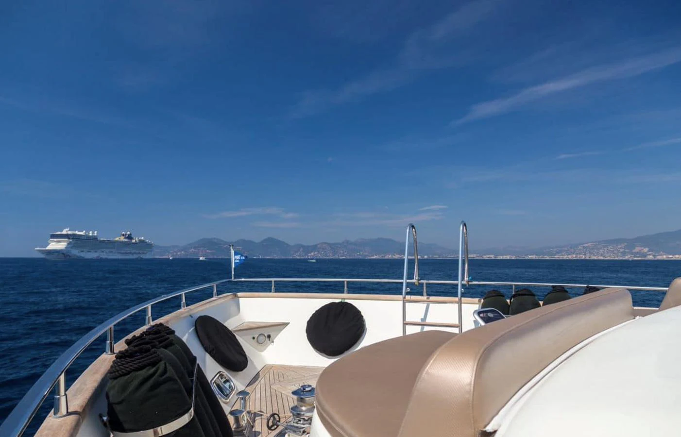 The bow of the yacht offers a serene view of the open sea and distant coastline. aboard ACCAMA DELTA Yacht for Sale