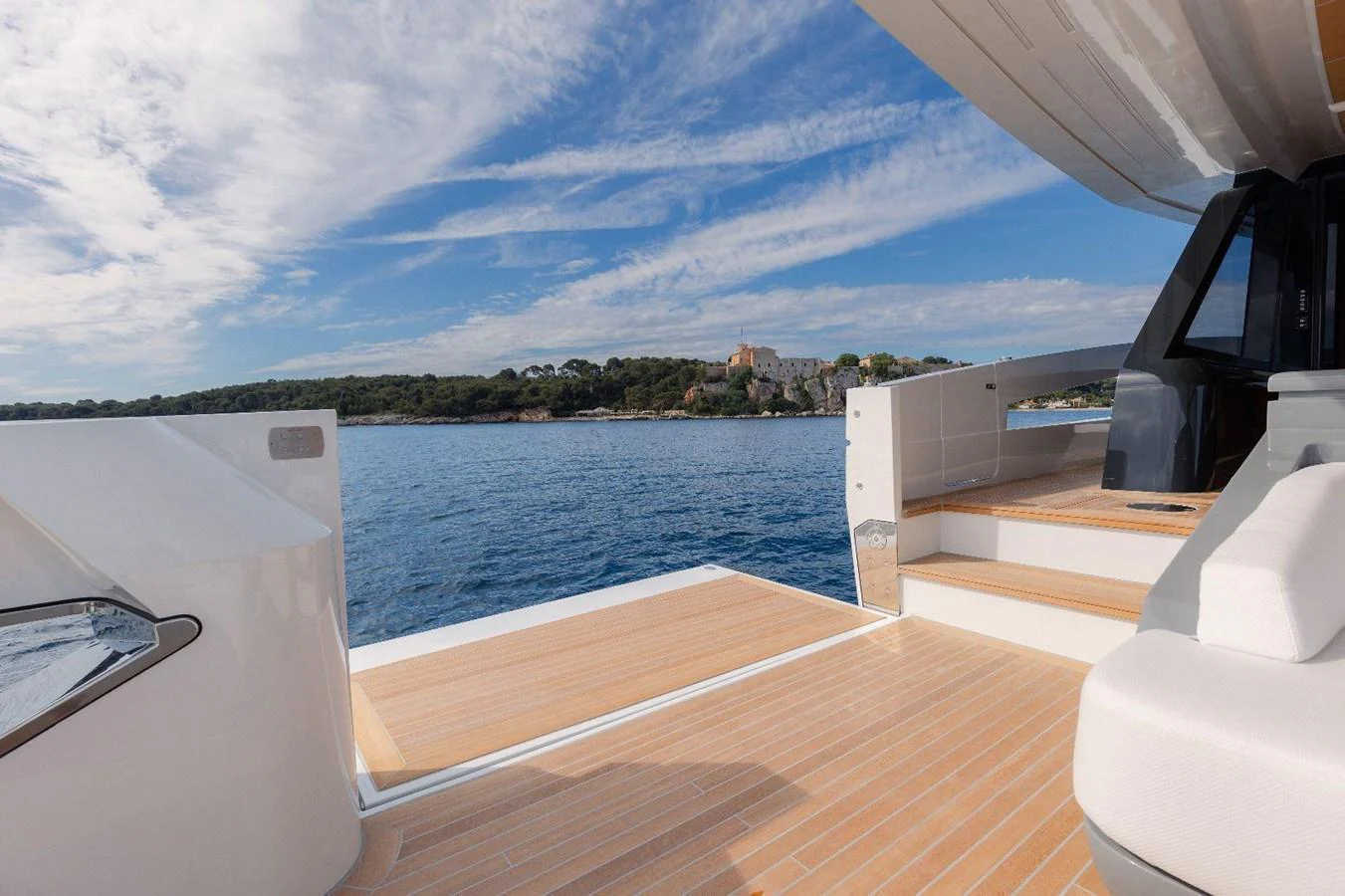 The aft deck offers a spacious and inviting area with stunning views of the surrounding waters and coastline. aboard MINI Yacht for Sale