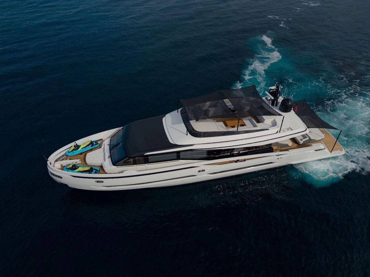 A sleek and modern yacht cruises gracefully on the open water, showcasing its luxurious design and spacious deck areas. aboard MINI Yacht for Sale