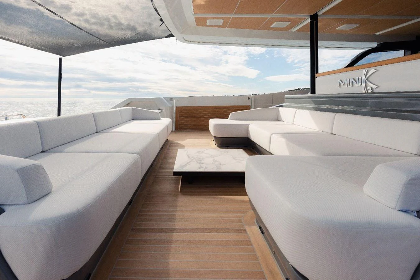 The flybridge offers a spacious seating area with elegant design and panoramic views. aboard MINI Yacht for Sale