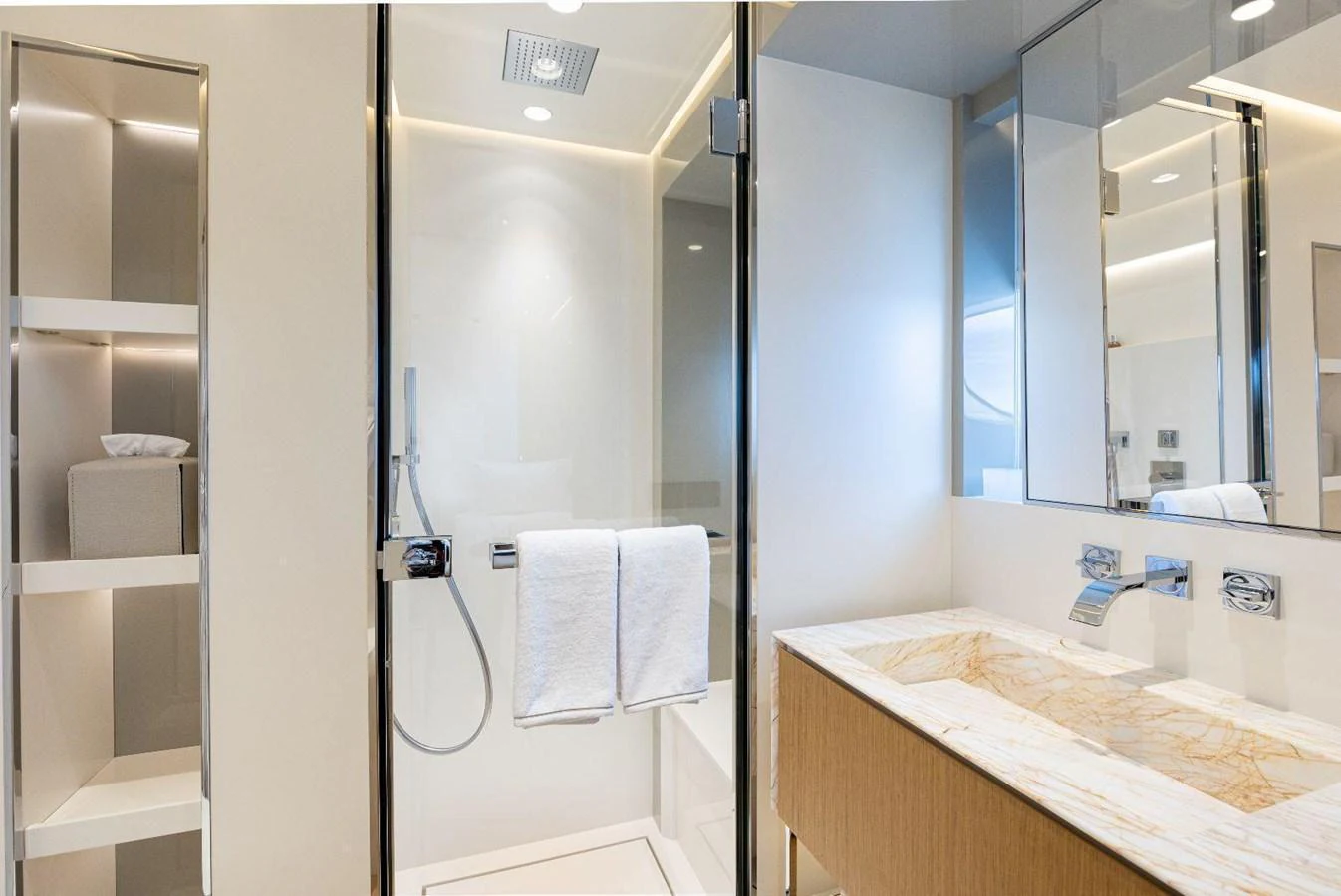 The yacht's bathroom features a modern design with a spacious shower and elegant fixtures. aboard MINI Yacht for Sale