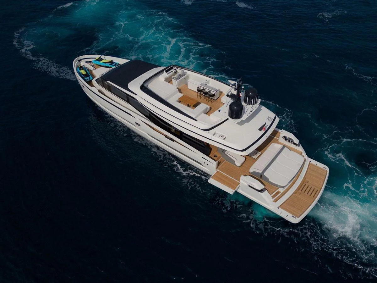 A sleek and modern yacht cruising through deep blue waters, showcasing its spacious decks and luxurious amenities. aboard MINI Yacht for Sale