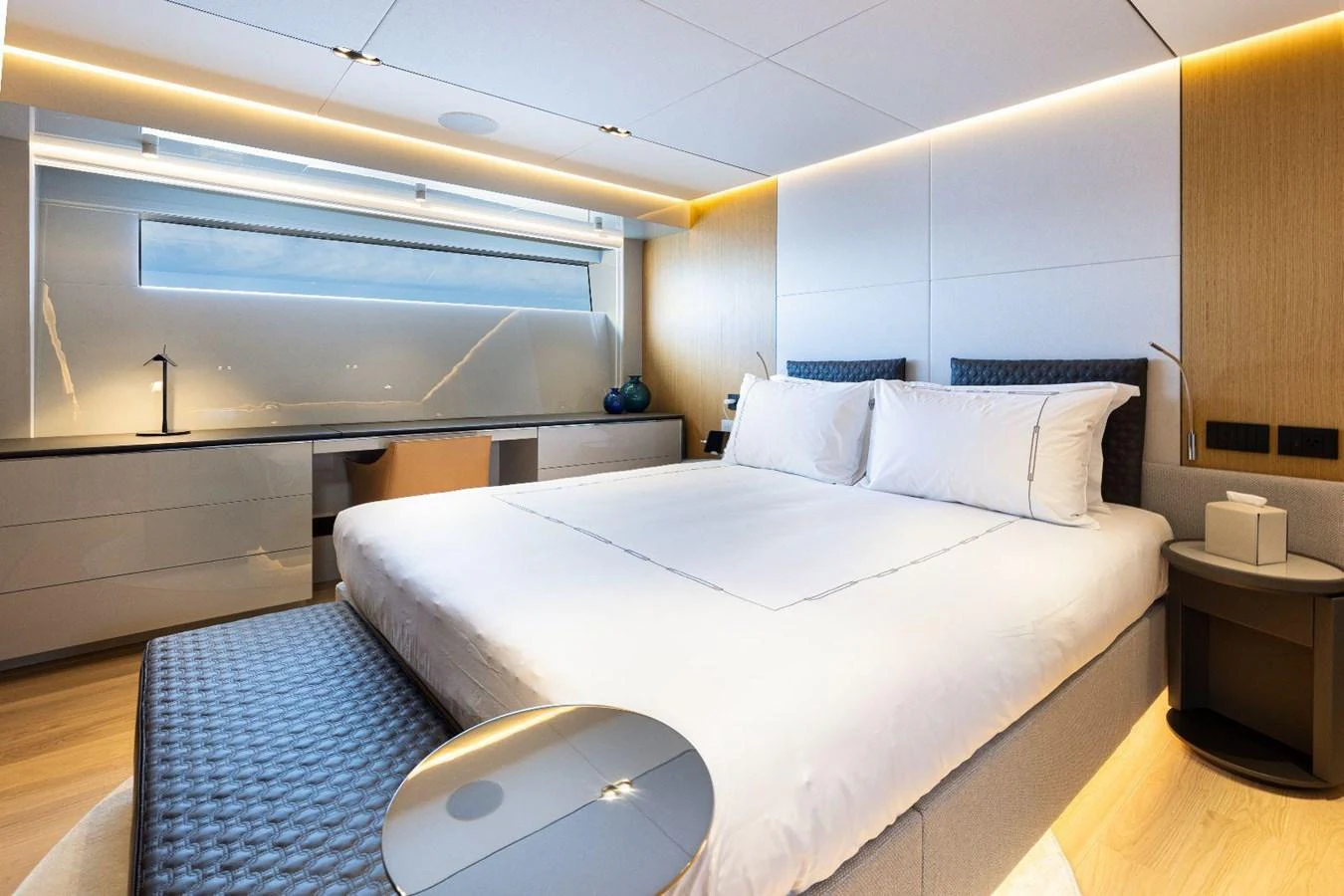 A luxurious stateroom with modern furnishings and ambient lighting. aboard MINI Yacht for Sale