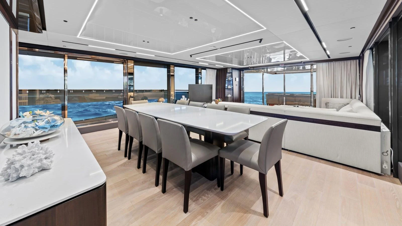 The yacht's dining area offers a spacious and elegant setting with panoramic ocean views. aboard CONTESSA Yacht for Sale