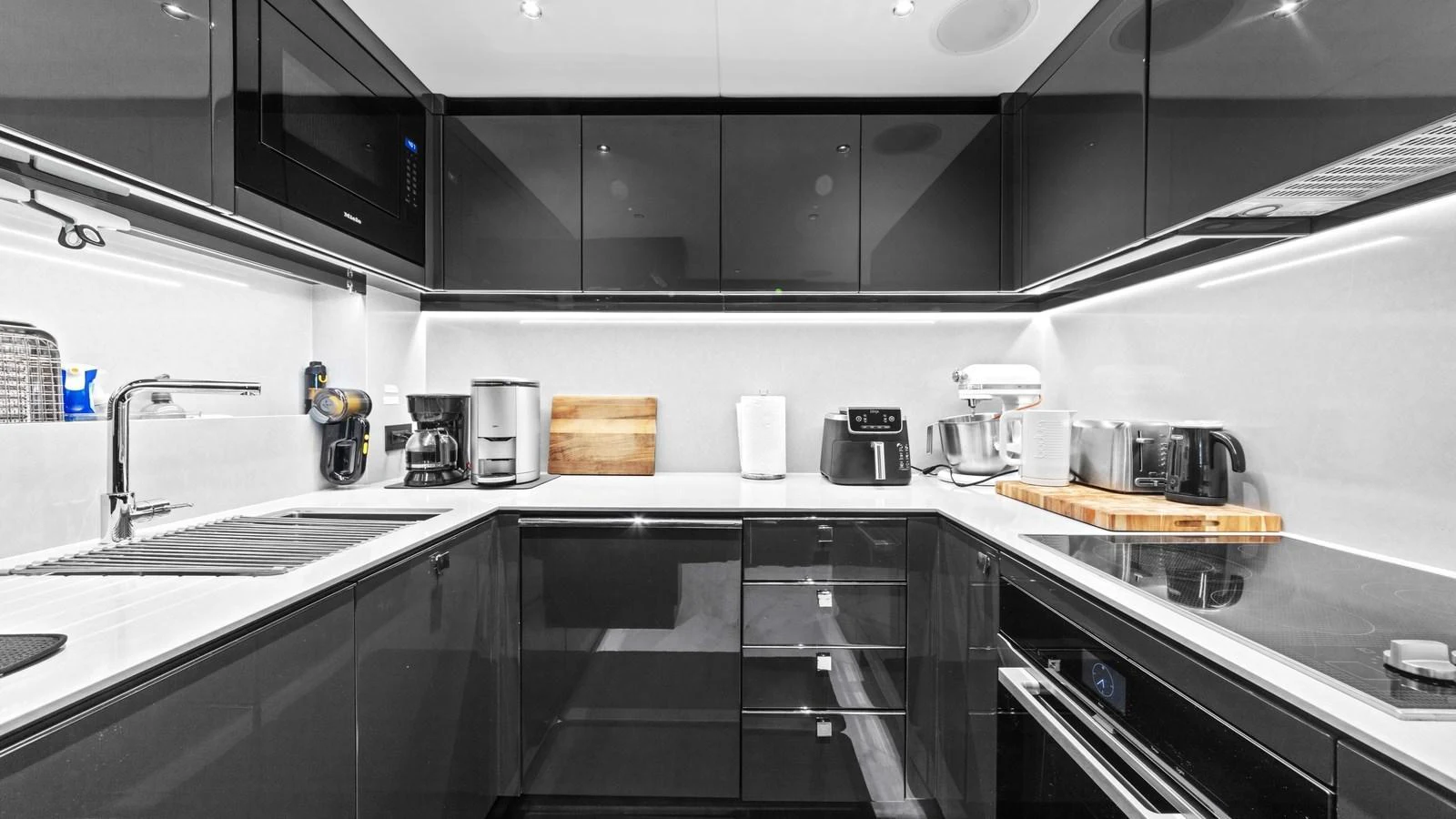 The sleek and modern galley is equipped with top-of-the-line appliances and ample counter space. aboard CONTESSA Yacht for Sale