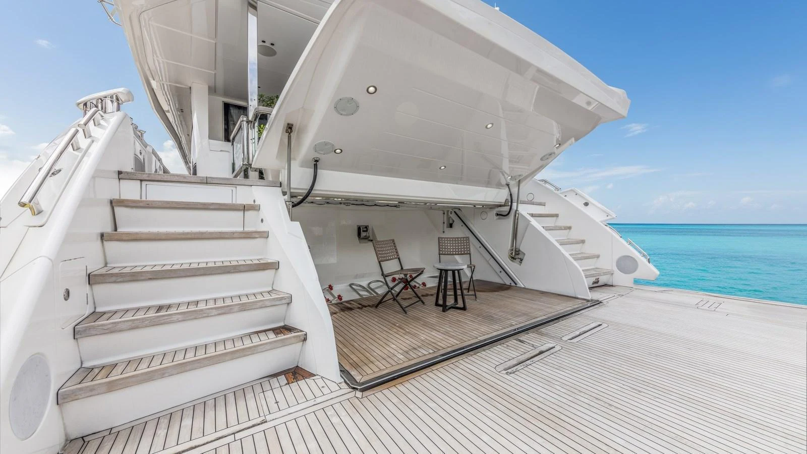 The yacht features a spacious beach club with comfortable seating and easy access to the water. aboard CONTESSA Yacht for Sale