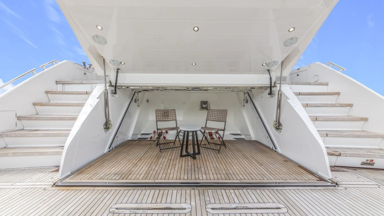 The yacht features a spacious beach club with comfortable seating and a serene ambiance. aboard CONTESSA Yacht for Sale
