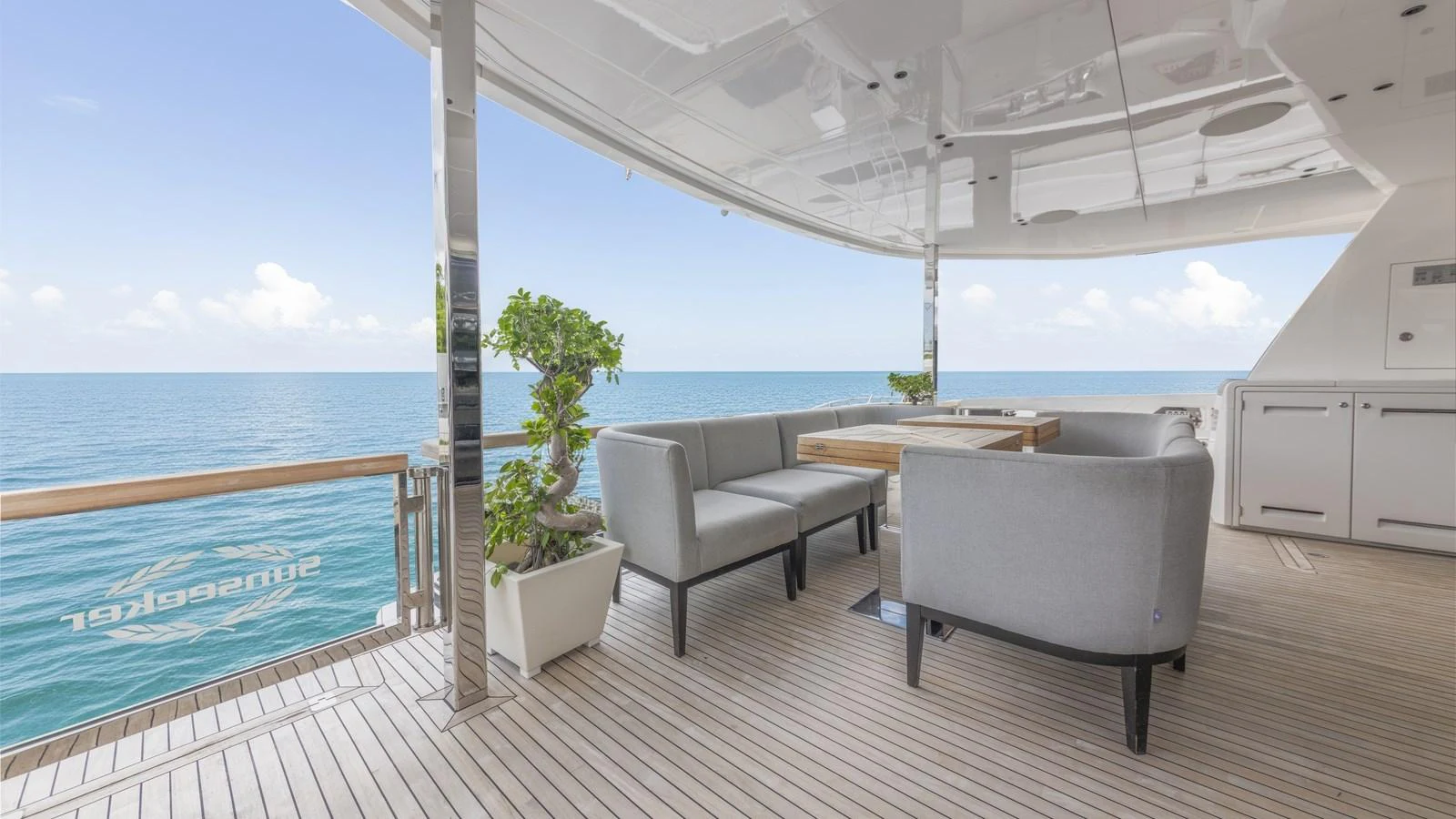 The aft deck offers a serene outdoor seating area with stunning ocean views. aboard CONTESSA Yacht for Sale