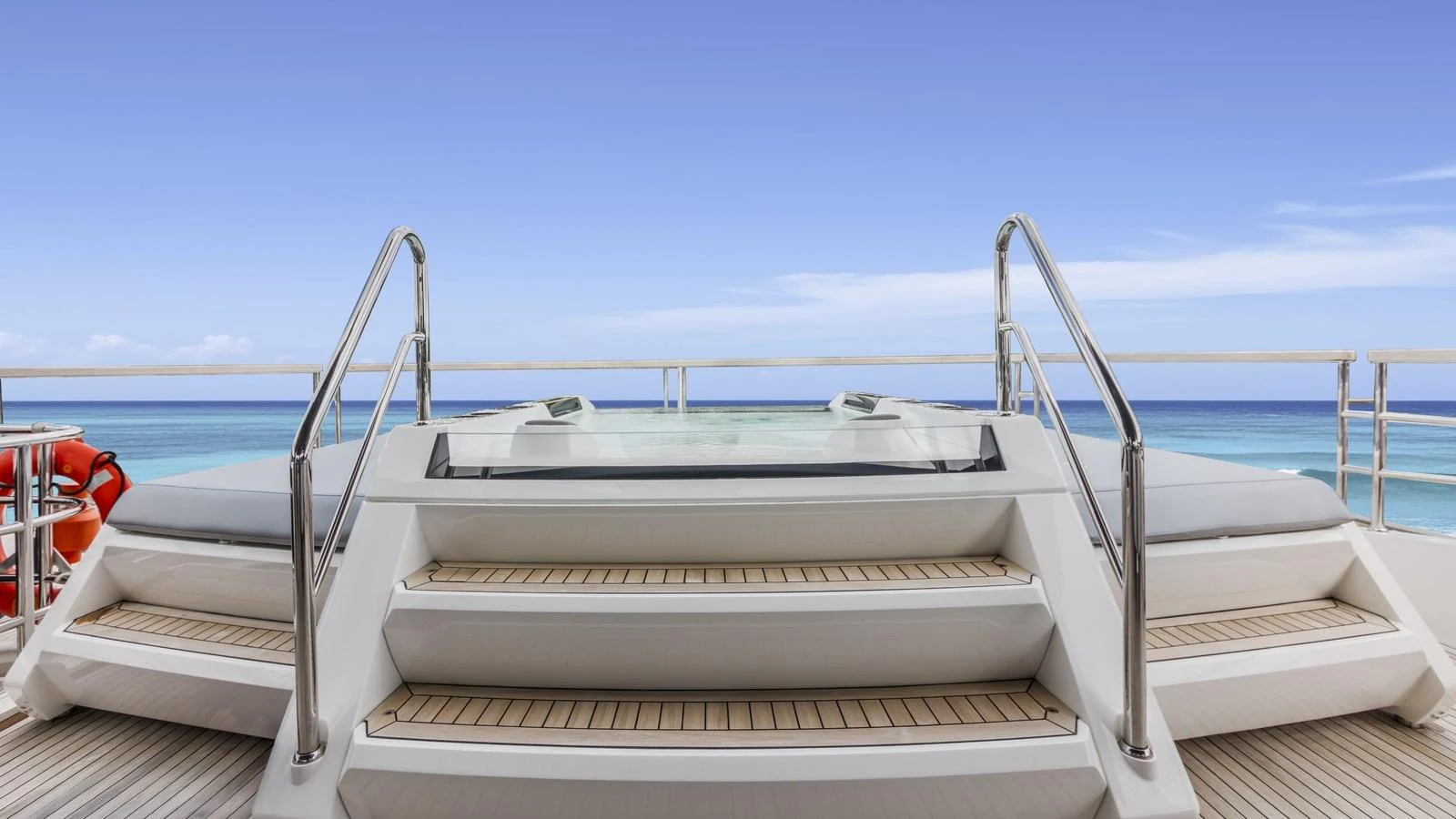The yacht features a luxurious jacuzzi with stunning ocean views. aboard CONTESSA Yacht for Sale