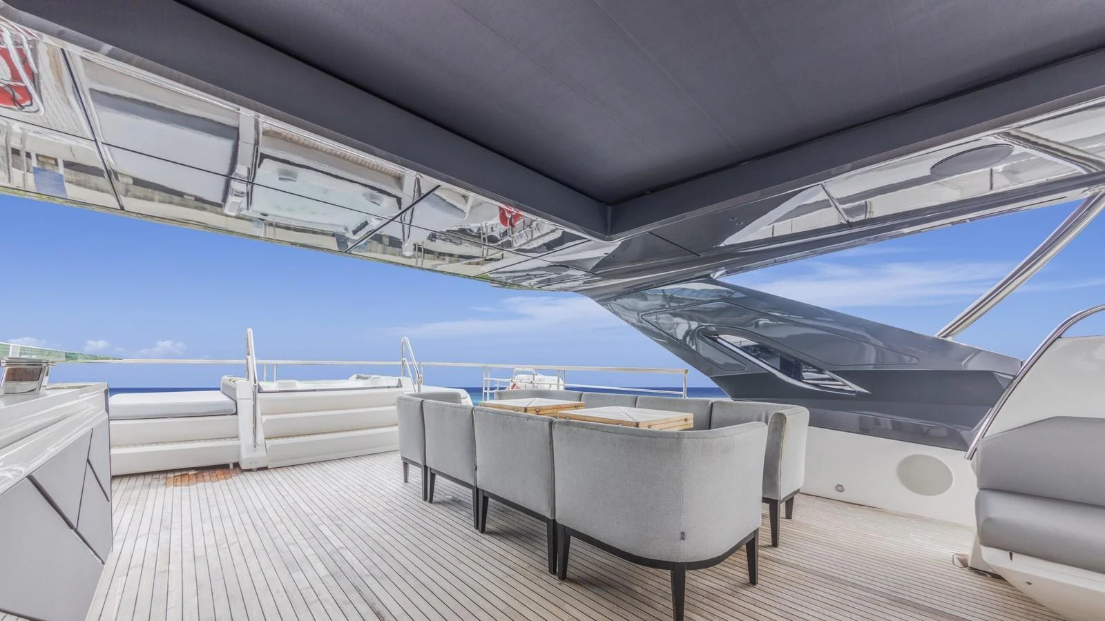 The aft deck offers a spacious and elegant outdoor dining area with stunning ocean views. aboard CONTESSA Yacht for Sale