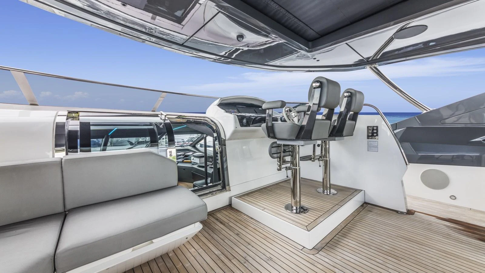 The sleek and modern helm station offers a commanding view and luxurious seating. aboard CONTESSA Yacht for Sale