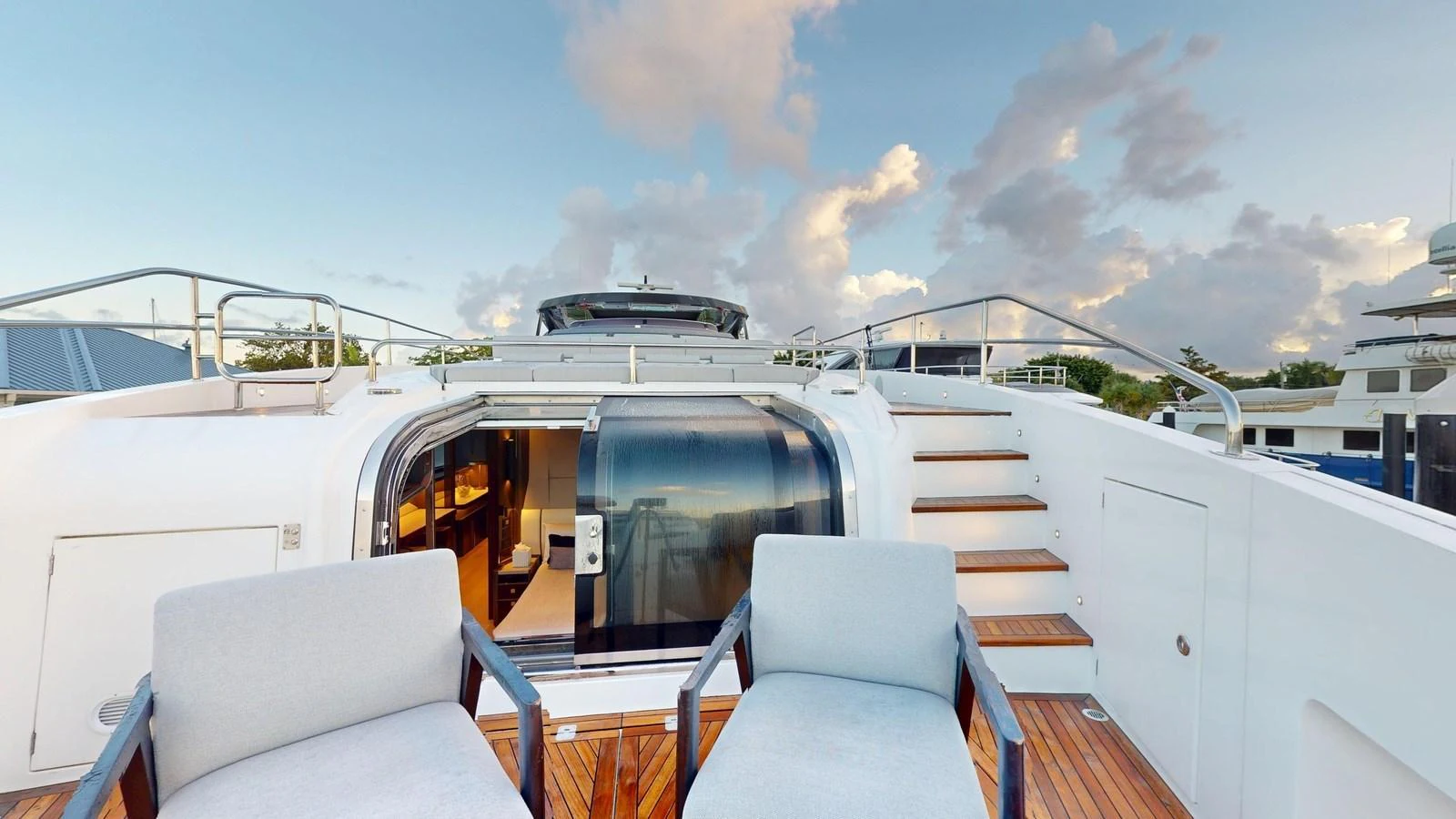 The sundeck offers a relaxing space with comfortable seating and a view of the sky. aboard CONTESSA Yacht for Sale