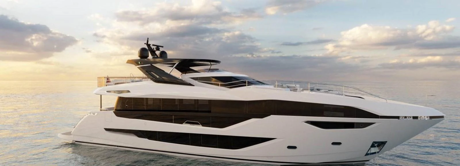 A sleek and modern yacht glides gracefully on calm waters at sunset. aboard CONTESSA Yacht for Sale