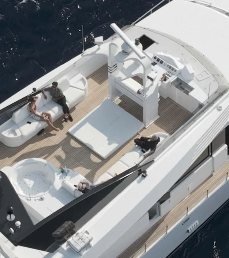 a group of people sitting on the floor of a building aboard BELLINI Yacht for Sale