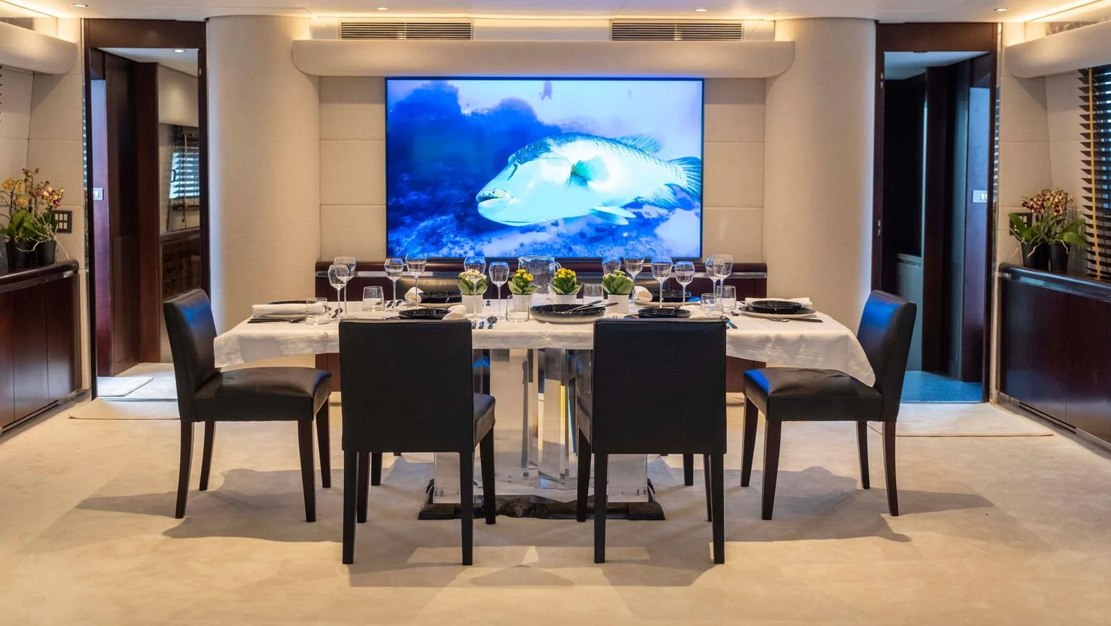 a large table with chairs around it aboard BELLINI Yacht for Sale