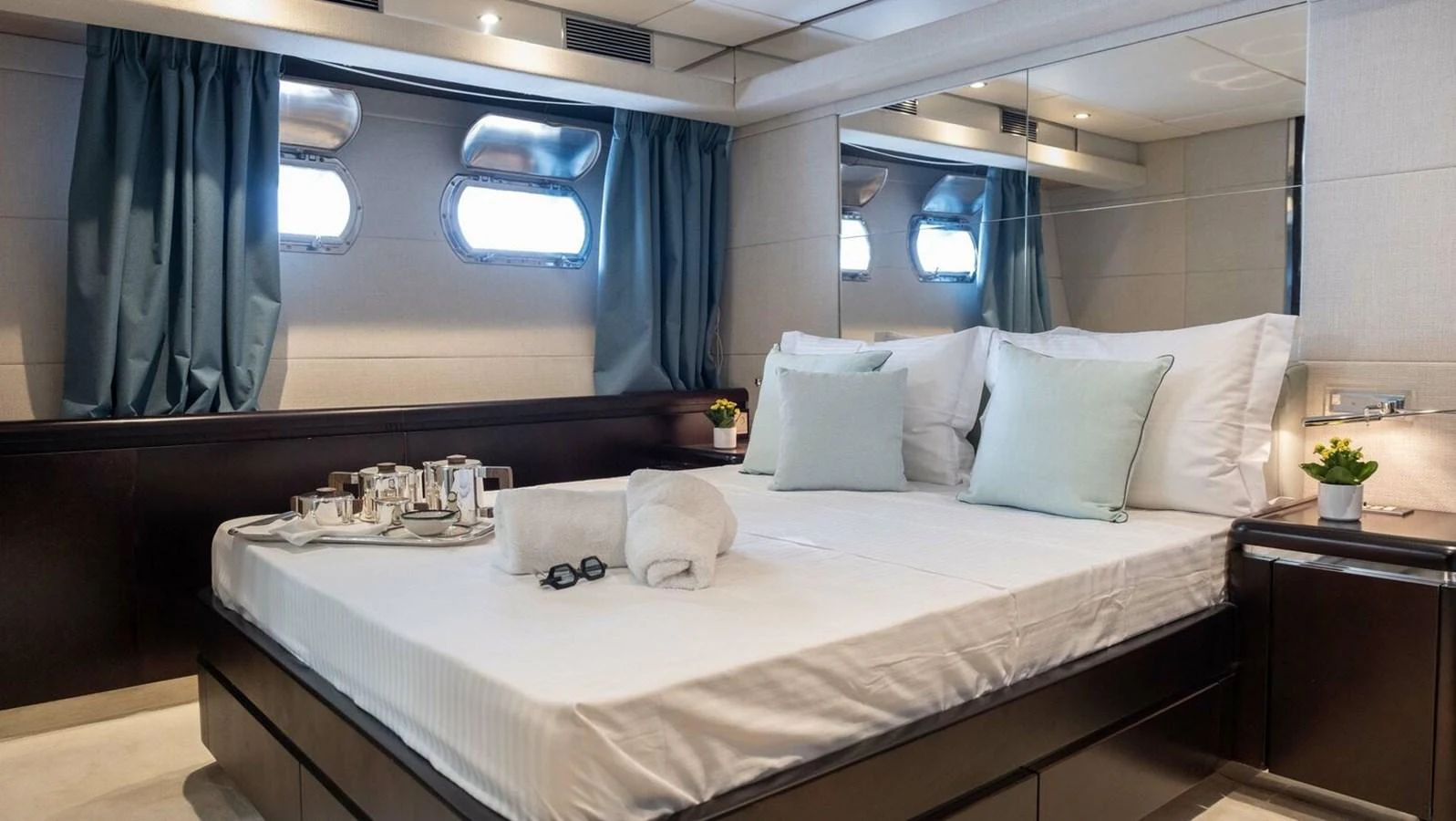 a bed with white pillows aboard BELLINI Yacht for Sale