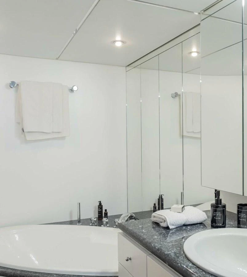 a bathroom with a large mirror aboard BELLINI Yacht for Sale