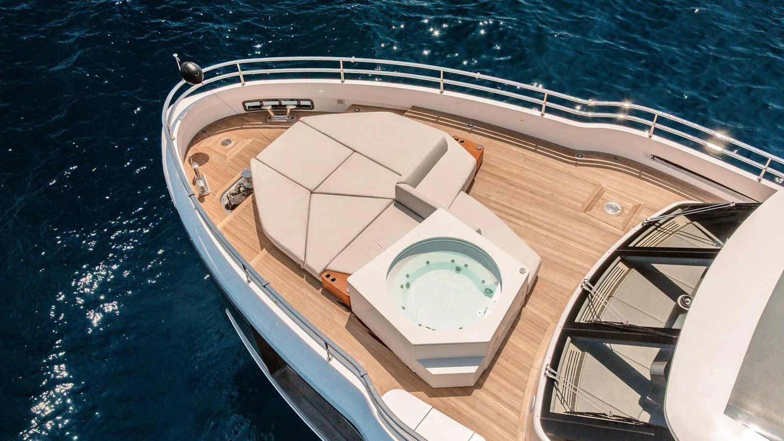The foredeck features a luxurious jacuzzi and sunbathing area with stunning ocean views. aboard ARIA Yacht for Sale