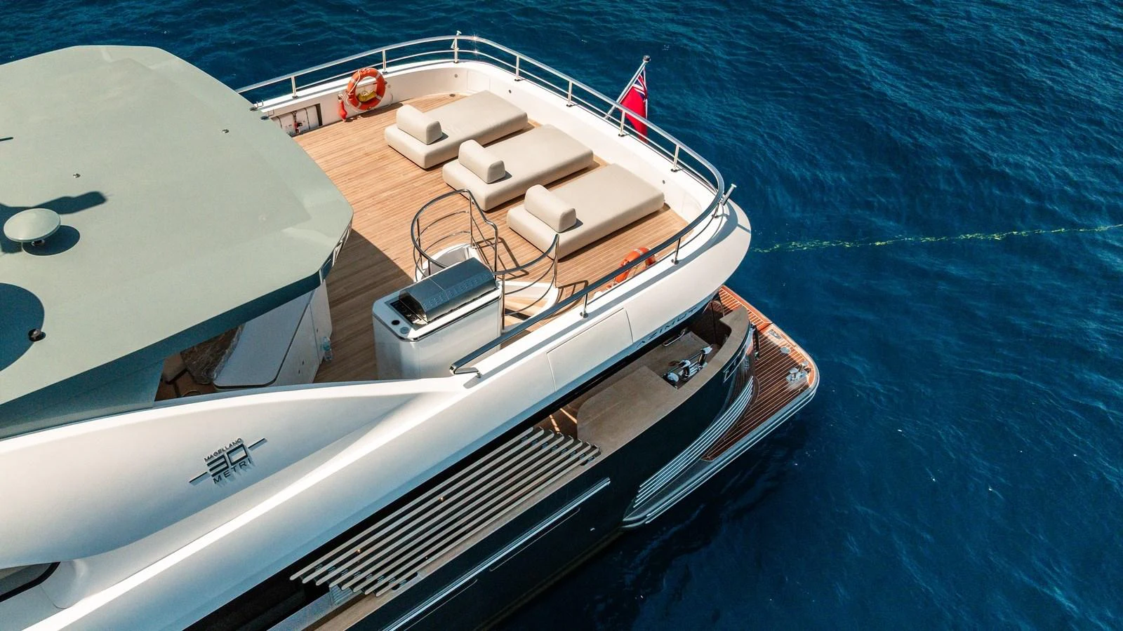 The yacht features a spacious sundeck with luxurious sun loungers and a sleek design. aboard ARIA Yacht for Sale