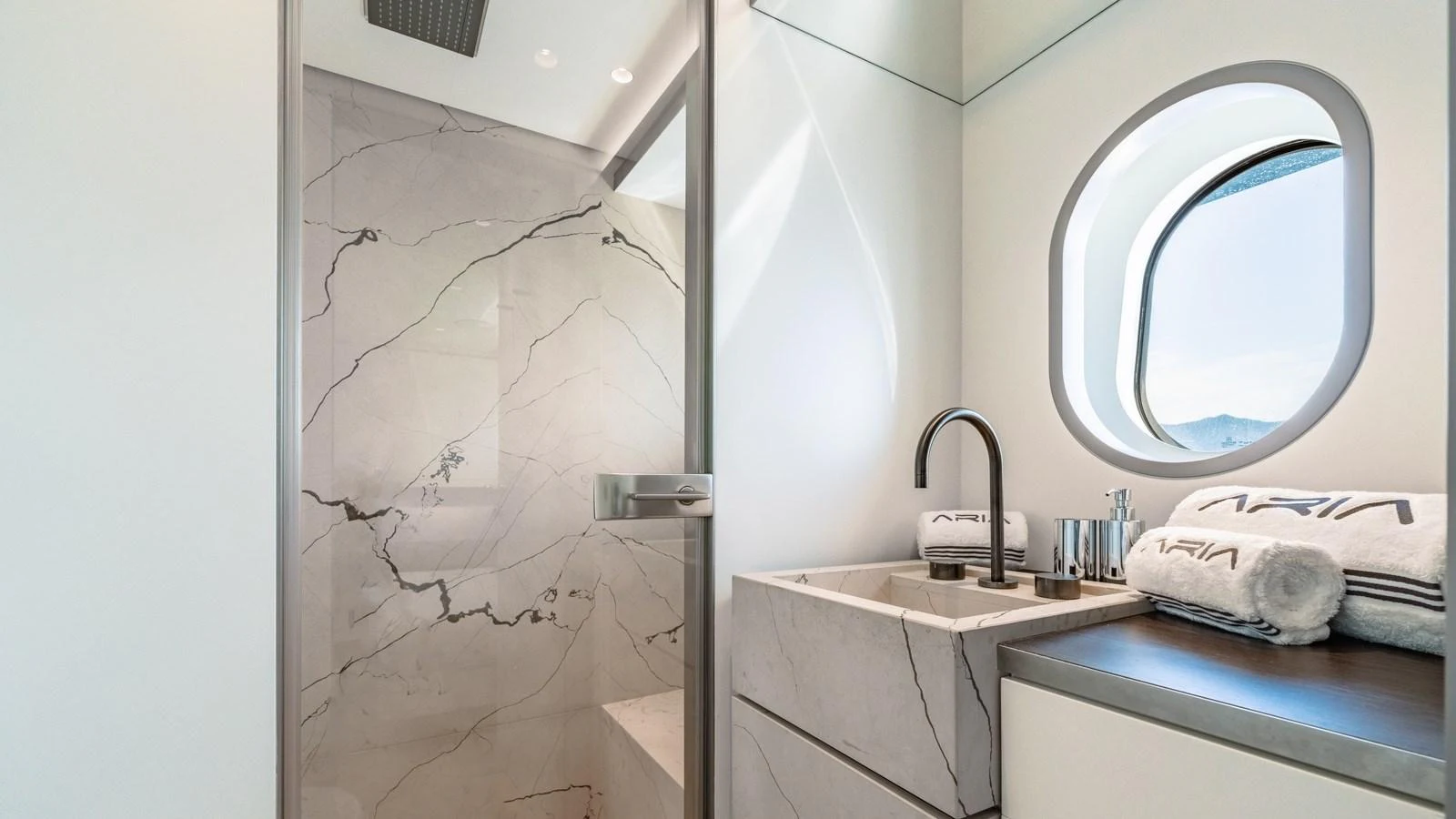 The yacht's bathroom features elegant marble surfaces and modern fixtures, creating a luxurious and serene atmosphere. aboard ARIA Yacht for Sale