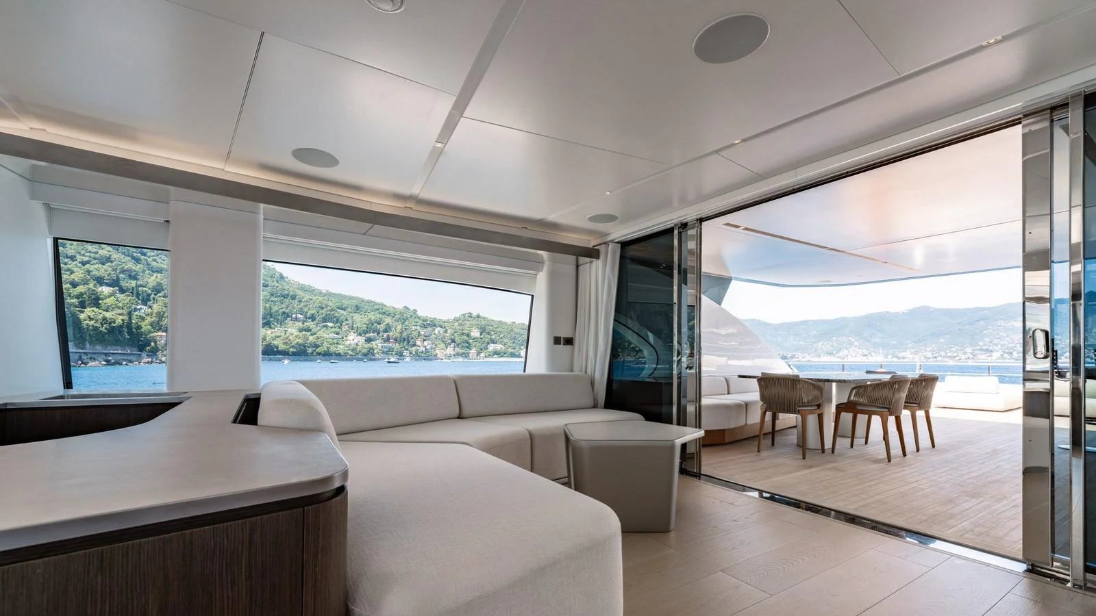 The salon offers a seamless transition to the aft deck with panoramic views and modern furnishings. aboard ARIA Yacht for Sale
