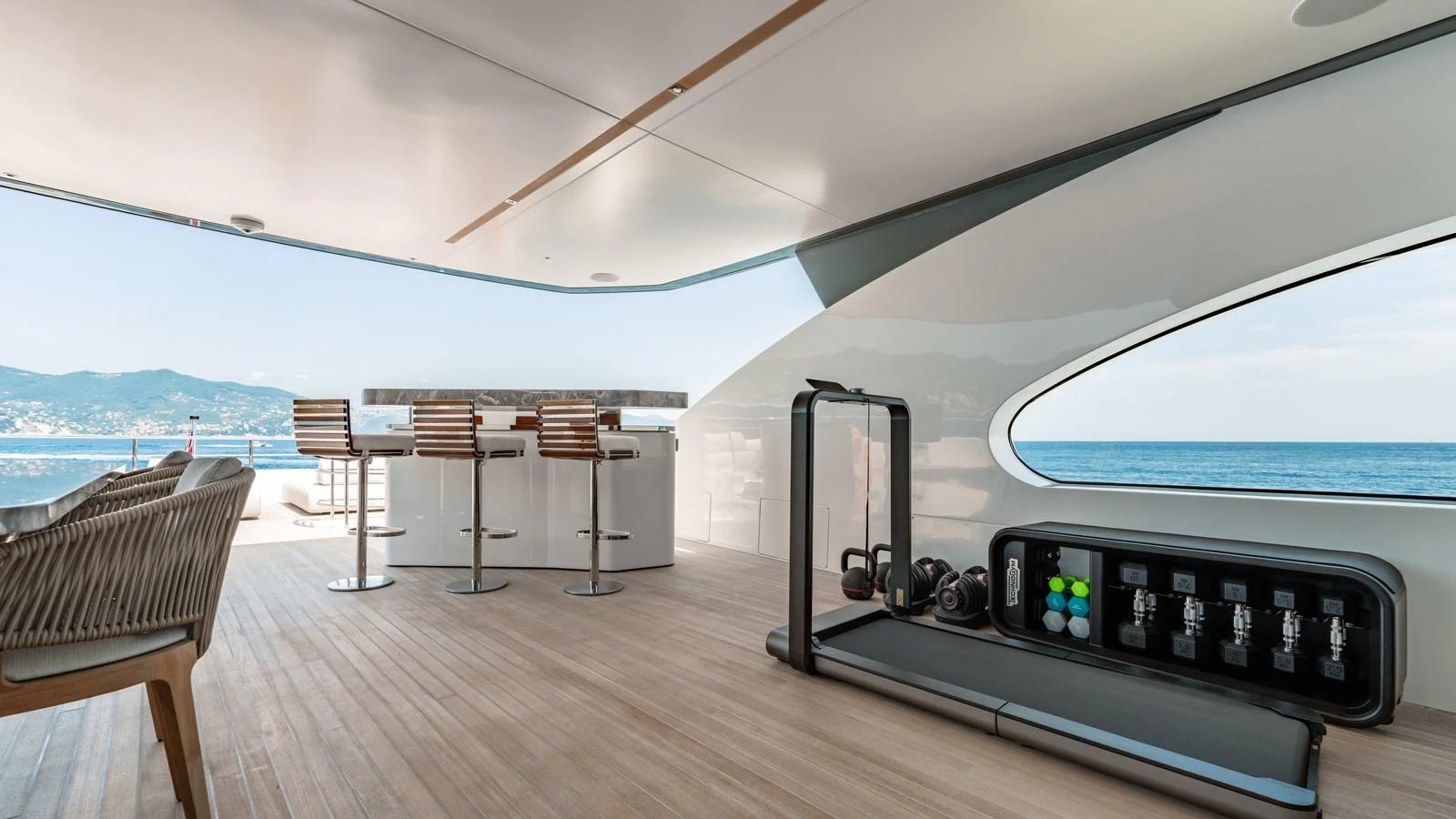 This yacht features a sleek gym area with modern equipment and a stunning ocean view. aboard ARIA Yacht for Sale