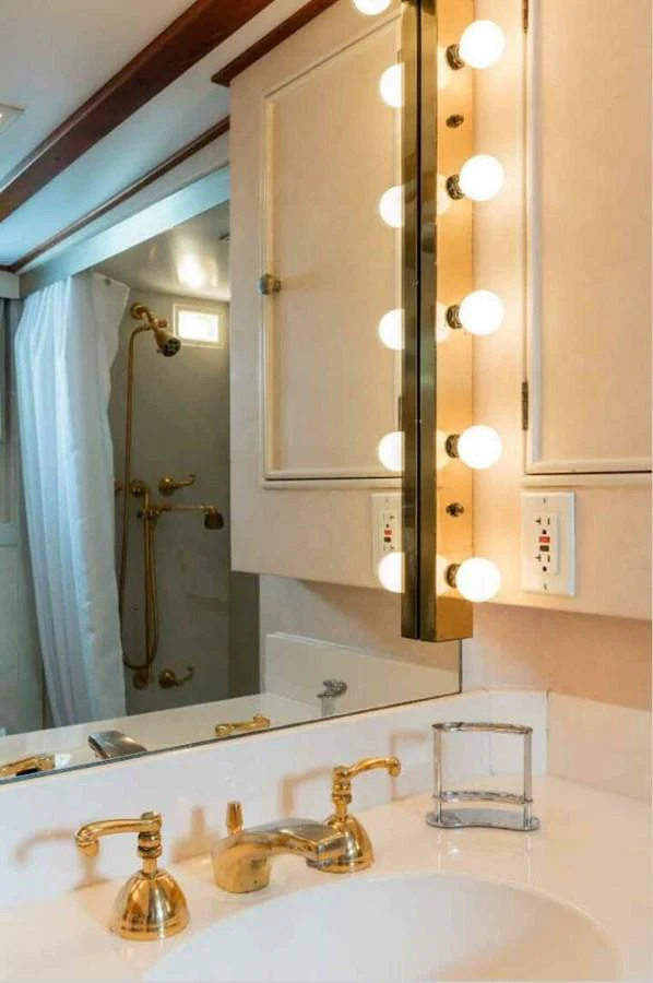 The yacht's bathroom features elegant fixtures and a well-lit vanity area. aboard SEAFARI Yacht for Sale