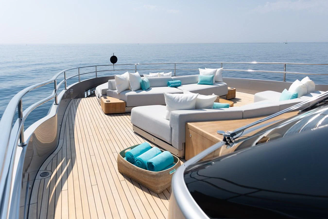 The sundeck offers a luxurious lounging area with plush seating and stunning ocean views. aboard PALMAX Yacht for Sale