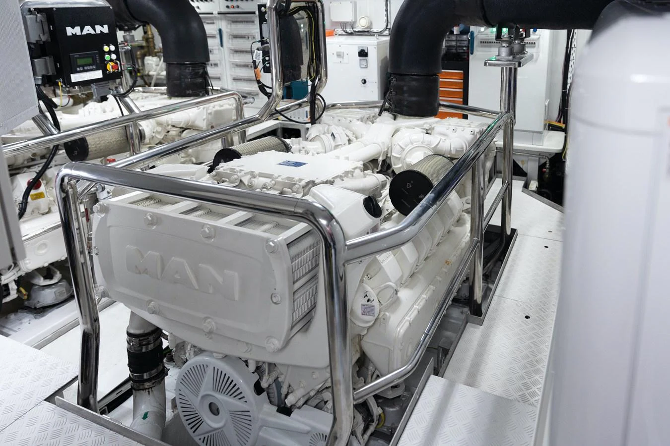 The image showcases the engine room with a powerful MAN engine. aboard PALMAX Yacht for Sale