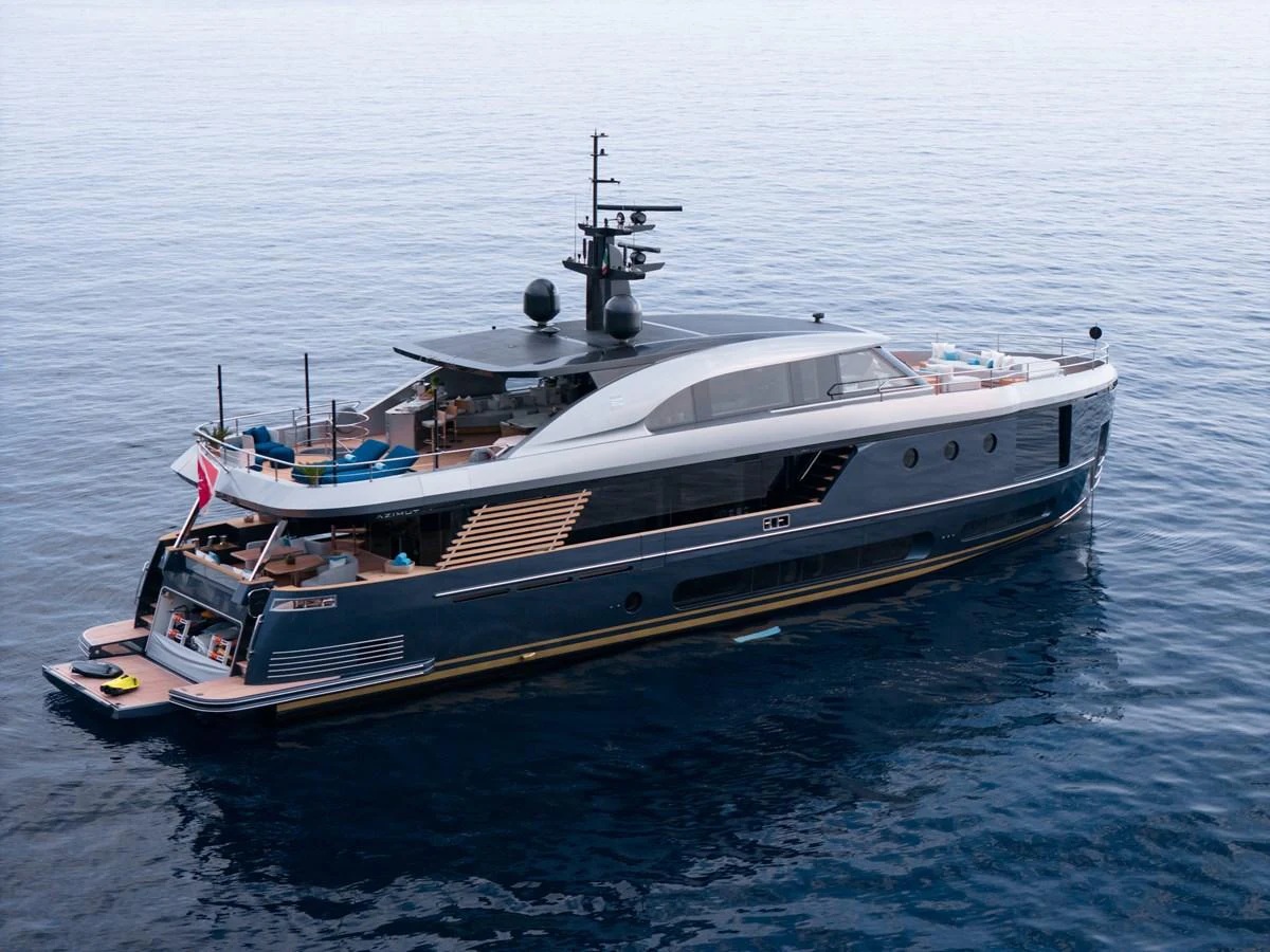 A sleek and modern yacht glides gracefully on calm waters, showcasing its luxurious design and spacious decks. aboard PALMAX Yacht for Sale