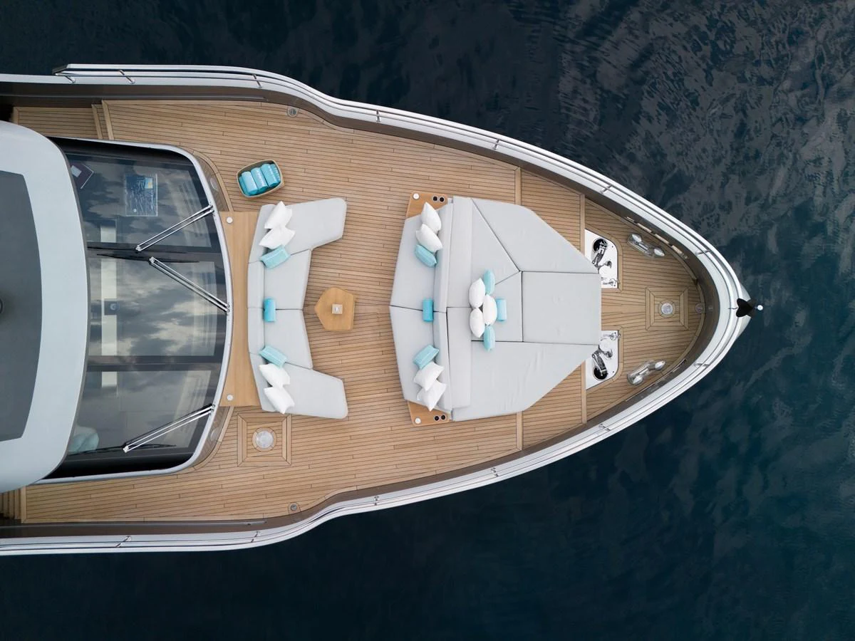 The foredeck features luxurious sun loungers and a cozy seating area, perfect for relaxation. aboard PALMAX Yacht for Sale