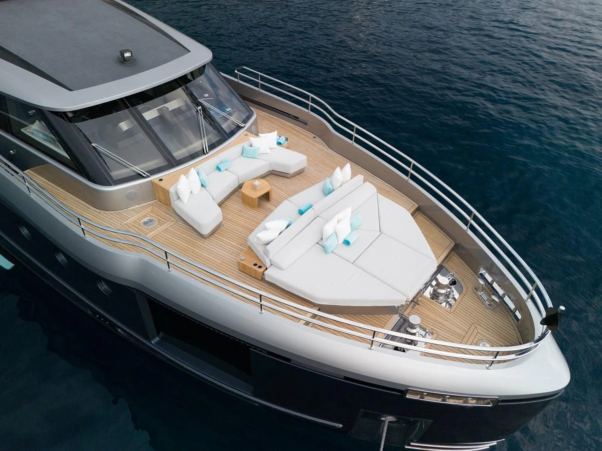 The yacht's foredeck features luxurious sunbeds and seating areas, perfect for relaxation and enjoying the sea views. aboard PALMAX Yacht for Sale