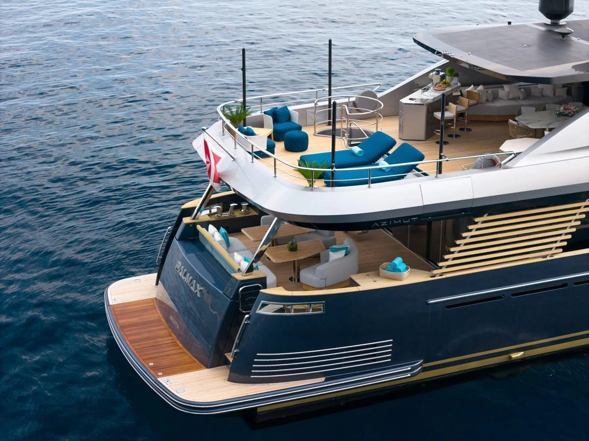 The yacht's aft deck offers luxurious seating and lounging areas overlooking the water. aboard PALMAX Yacht for Sale