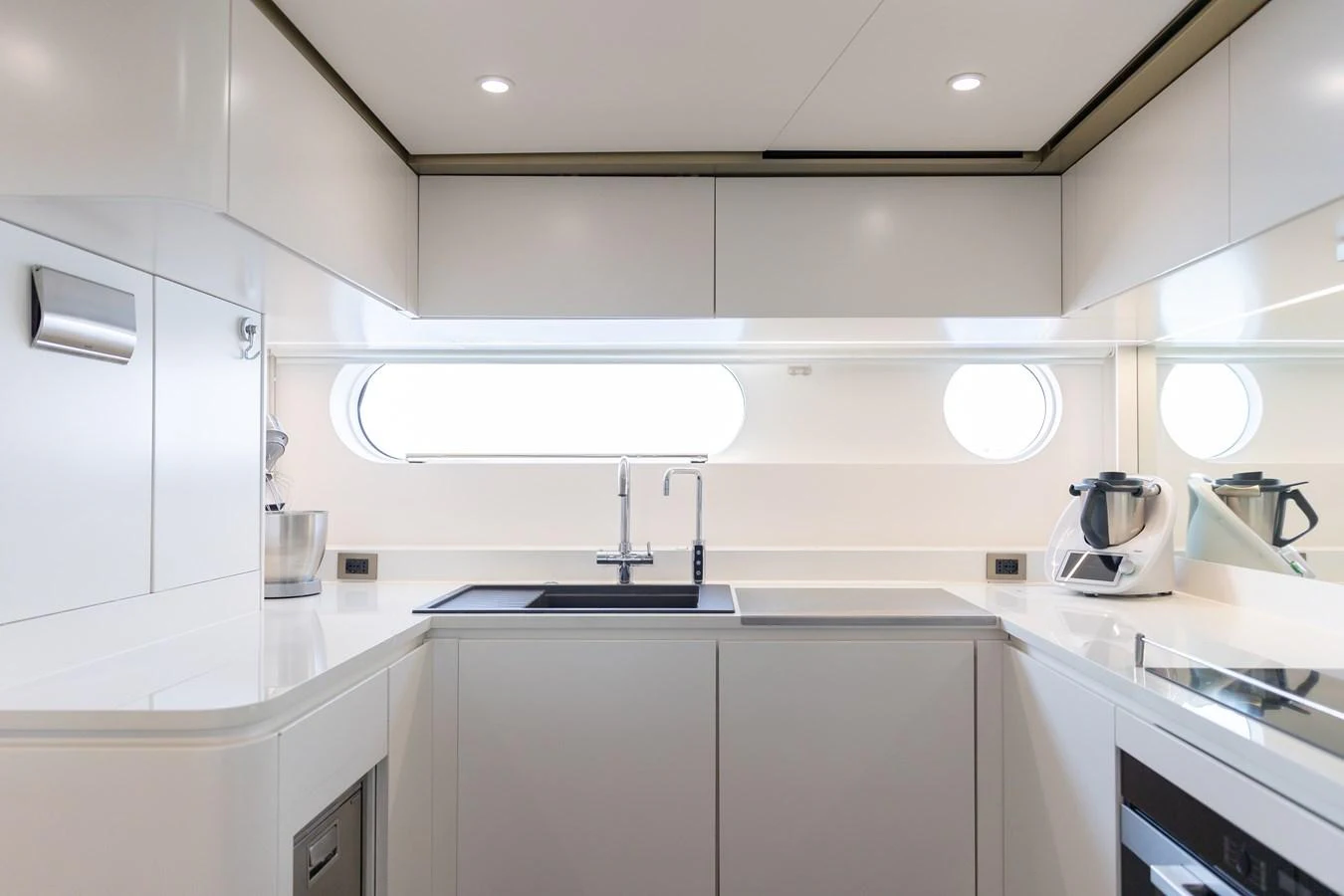 The yacht's galley is sleek and modern, featuring high-end appliances and ample counter space. aboard PALMAX Yacht for Sale