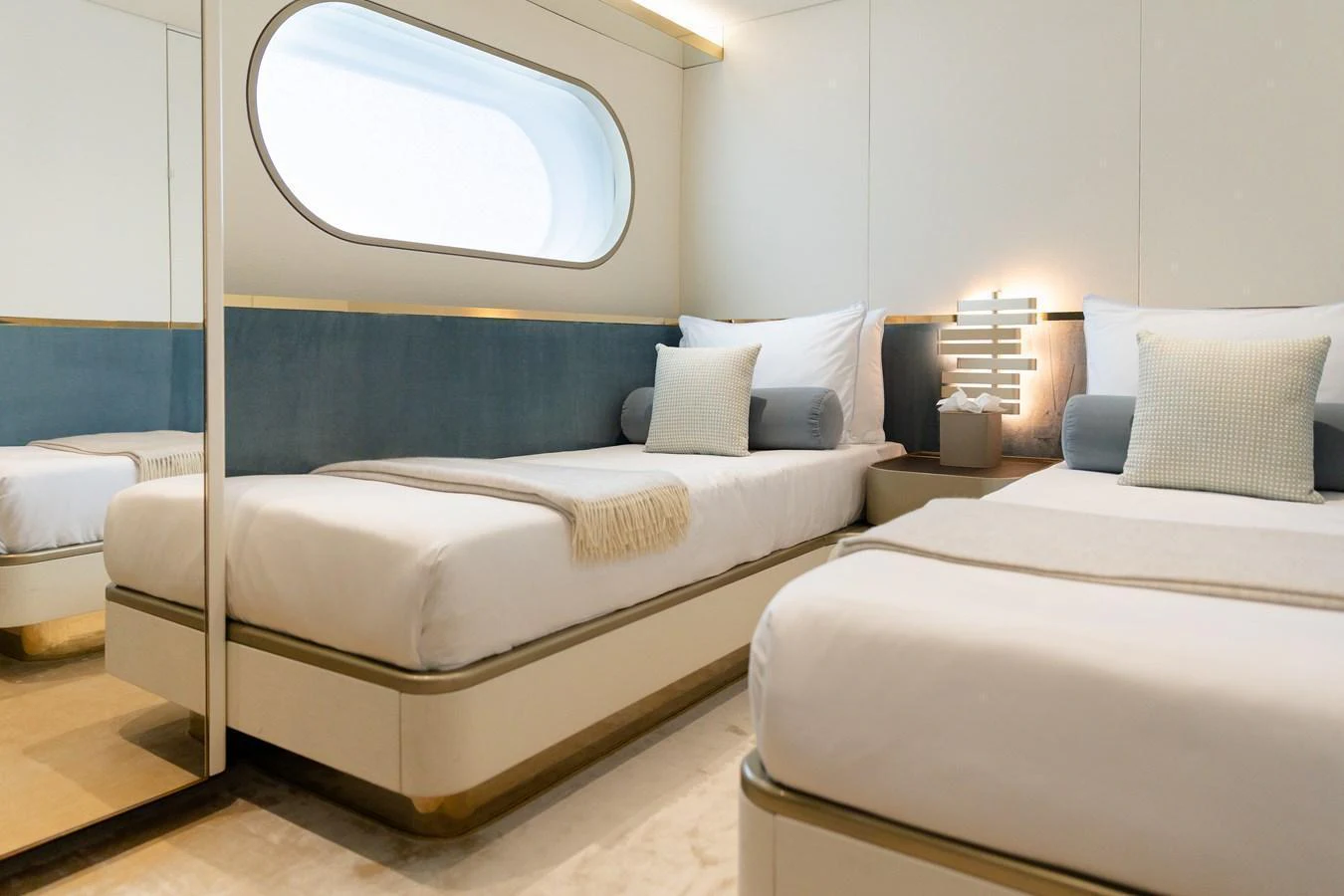 The guest stateroom features twin beds with modern decor and ample natural light. aboard PALMAX Yacht for Sale